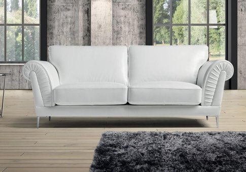 Λευκός καναπές με καμπυλωτά μπράτσα
